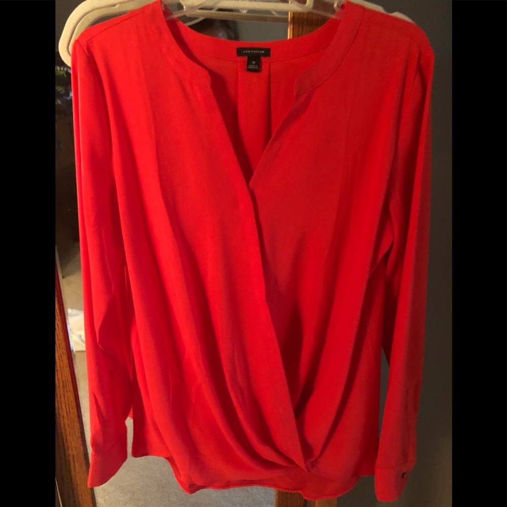 Beautiful orange Long sleeved blouse.